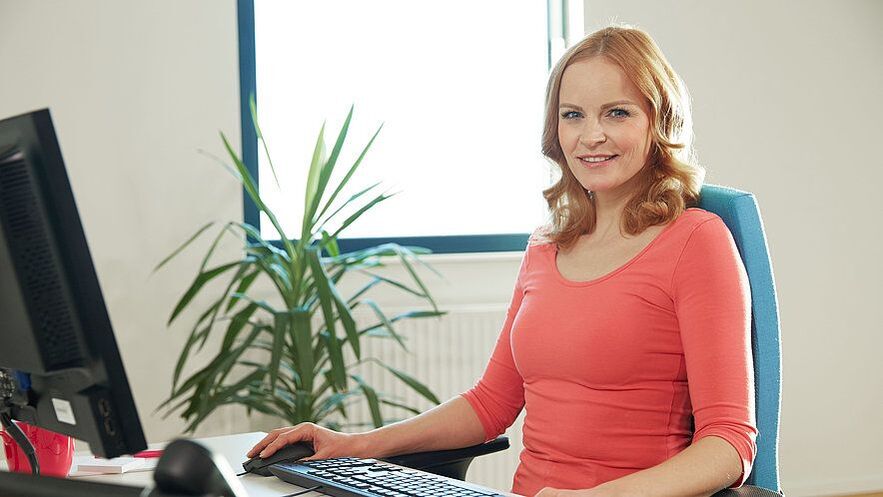 Women in an ergonomic workplace can relieve back pain