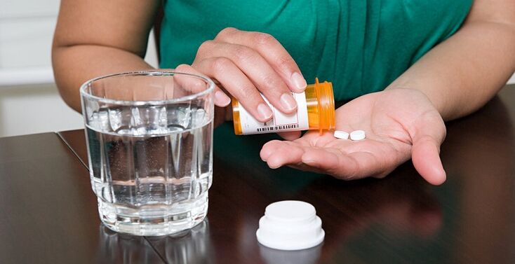 Taking medication to relieve back pain